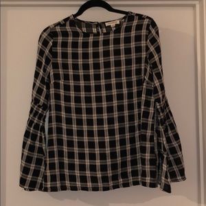 Black and white plaid blouse.